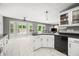 Open kitchen featuring white cabinets, black hardware, and an attached breakfast nook at 7833 Meadow Bend Dr, Indianapolis, IN 46259