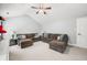 Spacious living room featuring high ceilings, modern fan, and comfortable seating at 7833 Meadow Bend Dr, Indianapolis, IN 46259
