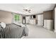 Spacious bedroom with ceiling fan, neutral paint, and mirror for getting ready at 7833 Meadow Bend Dr, Indianapolis, IN 46259