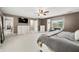 Expansive bedroom with ceiling fan, neutral paint, and TV for the ultimate relaxation at 7833 Meadow Bend Dr, Indianapolis, IN 46259