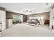 This bedroom offers a ceiling fan, natural light, and space for a seating area at 7833 Meadow Bend Dr, Indianapolis, IN 46259