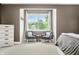 Sitting area in primary suite with 2 chairs, natural light, and additional storage at 7833 Meadow Bend Dr, Indianapolis, IN 46259