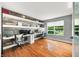 Spacious office with custom wood accent wall and built-in shelving at 7833 Meadow Bend Dr, Indianapolis, IN 46259