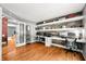 Large office space with a built-in desk and wood accent wall at 7833 Meadow Bend Dr, Indianapolis, IN 46259