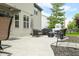 Outdoor patio with wicker furniture, grill, and shade umbrella at 7833 Meadow Bend Dr, Indianapolis, IN 46259