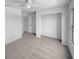 This carpeted bedroom features a ceiling fan, a closet, and an ensuite entrance to the bathroom at 7854 Wolfgang Pl, Indianapolis, IN 46239