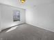 Cozy bedroom with neutral carpet and a large window providing natural light at 7854 Wolfgang Pl, Indianapolis, IN 46239