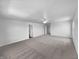 Minimalist bedroom with neutral carpet and ceiling fan at 7854 Wolfgang Pl, Indianapolis, IN 46239