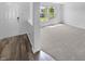 Inviting entryway featuring modern flooring, neutral walls, and ample natural light at 7854 Wolfgang Pl, Indianapolis, IN 46239