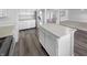 Bright kitchen featuring white cabinets, stainless steel appliances, and a kitchen island at 7854 Wolfgang Pl, Indianapolis, IN 46239
