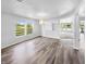 Bright living room featuring hardwood floors and large windows, perfect for entertaining at 7854 Wolfgang Pl, Indianapolis, IN 46239