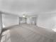 Vast living room with neutral carpet, ceiling fan, and an open layout at 7854 Wolfgang Pl, Indianapolis, IN 46239