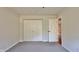 Bedroom with neutral color scheme, plush carpet, and double closet at 8176 Shorewalk Dr # C, Indianapolis, IN 46236