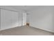 Bedroom with double closet doors and doorway to adjacent room at 8176 Shorewalk Dr # C, Indianapolis, IN 46236