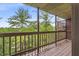 Deck with wood railing overlooking a lush view at 8176 Shorewalk Dr # C, Indianapolis, IN 46236