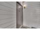 Neutral door entrance with overhead lighting, dark hardware, and a modern design at 8176 Shorewalk Dr # C, Indianapolis, IN 46236
