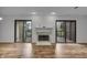 Elegant living room fireplace with sliding glass door that leads to a balcony at 8176 Shorewalk Dr # C, Indianapolis, IN 46236