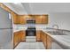 Bright kitchen with stainless steel appliances, including a microwave and oven, with light countertops at 8176 Shorewalk Dr # C, Indianapolis, IN 46236