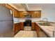 Kitchen featuring stainless steel appliances, wood cabinets, and stylish countertops at 8176 Shorewalk Dr # C, Indianapolis, IN 46236