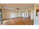 Open floorplan with wood floors, ceiling fan, and neutral walls perfect for customization at 8176 Shorewalk Dr # C, Indianapolis, IN 46236