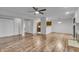 Spacious open living room with wood floors, adjacent kitchen, and great natural light at 8176 Shorewalk Dr # C, Indianapolis, IN 46236