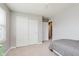 Bedroom with closet doors and adjacent room with a connecting doorway at 985 Farmington Trl, Brownsburg, IN 46112