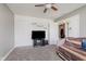 Neutral bedroom featuring a daybed, soft carpeting, ceiling fan, closet, and a TV for entertainment at 985 Farmington Trl, Brownsburg, IN 46112