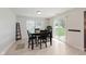 Bright dining area with table, chairs, and sliding glass door to the backyard at 985 Farmington Trl, Brownsburg, IN 46112