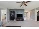 Comfortable living room with wall-mounted TV and dark accents and doorways leading to other rooms at 985 Farmington Trl, Brownsburg, IN 46112