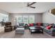 Inviting living room area filled with natural light from windows, plus neutral colored furniture at 985 Farmington Trl, Brownsburg, IN 46112