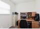 Home office featuring a wooden desk with computer, file cabinet, and window for natural light at 985 Farmington Trl, Brownsburg, IN 46112