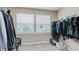 Organized walk-in closet with clothing racks and shelving providing storage solutions at 985 Farmington Trl, Brownsburg, IN 46112