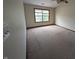 Large bedroom featuring a ceiling fan and carpet flooring with a large window overlooking the yard at 10150 Beresford Ct, Fishers, IN 46038