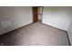 Spacious bedroom featuring neutral carpet, trim, and paint with a walk-in closet at 10150 Beresford Ct, Fishers, IN 46038