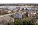 Stunning aerial view of homes with well-manicured lawns near a serene lake during the day at 10974 Harbor Bay Dr, Fishers, IN 46040