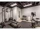 Basement home gym featuring workout equipment and exposed ceiling at 10974 Harbor Bay Dr, Fishers, IN 46040