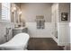 A serene bathroom features a classic clawfoot tub, elegant fixtures, and natural light at 10974 Harbor Bay Dr, Fishers, IN 46040