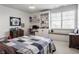 Bedroom with desk, window seat, and built-in shelving for storage at 10974 Harbor Bay Dr, Fishers, IN 46040