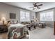 Bedroom featuring two beds, comfortable seating, and ample natural light at 10974 Harbor Bay Dr, Fishers, IN 46040