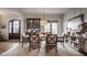 Traditional dining room with hardwood floors, elegant lighting, and a cozy atmosphere for Gathering gatherings at 10974 Harbor Bay Dr, Fishers, IN 46040
