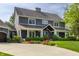 Stunning exterior view of a two-story home featuring a cozy front porch and beautiful landscaping at 10974 Harbor Bay Dr, Fishers, IN 46040