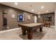 A recreational game room features a pool table, dining area, and stylish decor at 10974 Harbor Bay Dr, Fishers, IN 46040