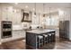 Bright kitchen featuring custom cabinetry, granite countertops, and stainless appliances at 10974 Harbor Bay Dr, Fishers, IN 46040