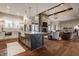 Open-concept kitchen with a center island and an adjacent living area with a fireplace at 10974 Harbor Bay Dr, Fishers, IN 46040