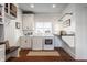 Functional laundry room with modern appliances, storage cabinets, and a folding station for convenience at 10974 Harbor Bay Dr, Fishers, IN 46040