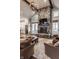 Bright living room featuring a stone fireplace, cozy seating, and an open layout, perfect for entertaining at 10974 Harbor Bay Dr, Fishers, IN 46040