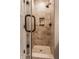 Tiled shower with glass door and built-in shelving for toiletries at 10974 Harbor Bay Dr, Fishers, IN 46040