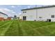 View of the home's lush backyard and exterior at 1124 Paradise Ct # B, Greenwood, IN 46143