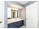 Bathroom with navy vanity, white countertops, and stylish fixtures at 1124 Paradise Ct # B, Greenwood, IN 46143