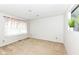 Bright bedroom with carpet flooring, light walls, and a window with floral curtains at 1124 Paradise Ct # B, Greenwood, IN 46143